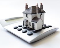 Calculator with model house on top